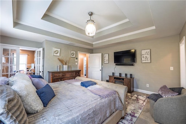 bedroom with crown molding, a raised ceiling, baseboards, and french doors