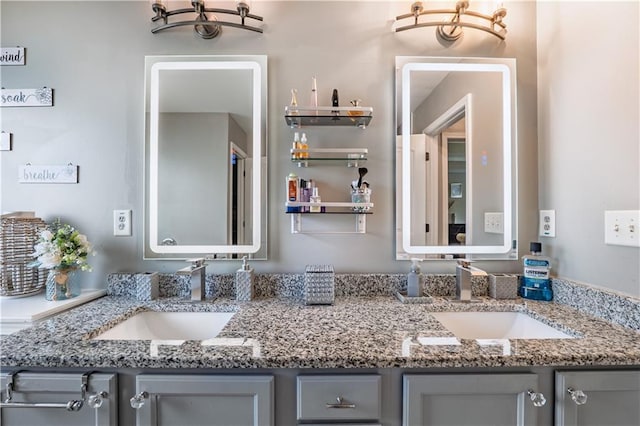 full bath featuring double vanity and a sink