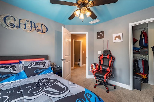 carpeted bedroom featuring a closet, a ceiling fan, baseboards, and visible vents