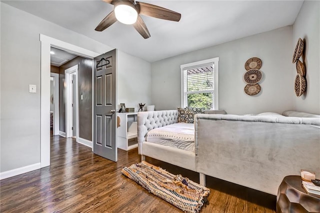 bedroom with wood finished floors, a ceiling fan, and baseboards