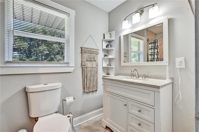 full bathroom with baseboards, toilet, a shower with curtain, tile patterned floors, and vanity