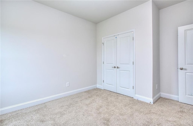 111 Ginger Trl, Homer, GA 30547 - unfurnished bedroom featuring carpet flooring, baseboards, and a closet
