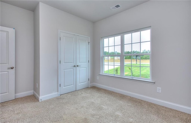 111 Ginger Trl, Homer, GA 30547 - unfurnished bedroom featuring carpet flooring, baseboards, and a closet