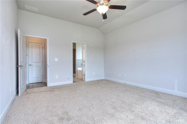 111 Ginger Trl, Homer, GA 30547 - unfurnished bedroom featuring light colored carpet, baseboards, vaulted ceiling, ensuite bathroom, and a ceiling fan