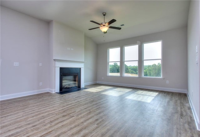 111 Ginger Trl, Homer, GA 30547 - unfurnished living room featuring wood finished floors, baseboards, and a glass covered fireplace