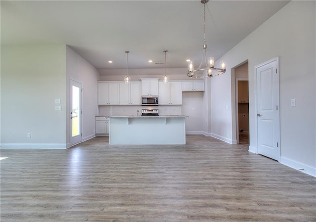 111 Ginger Trl, Homer, GA 30547 - kitchen featuring appliances with stainless steel finishes, a chandelier, white cabinets, open floor plan, and recessed lighting