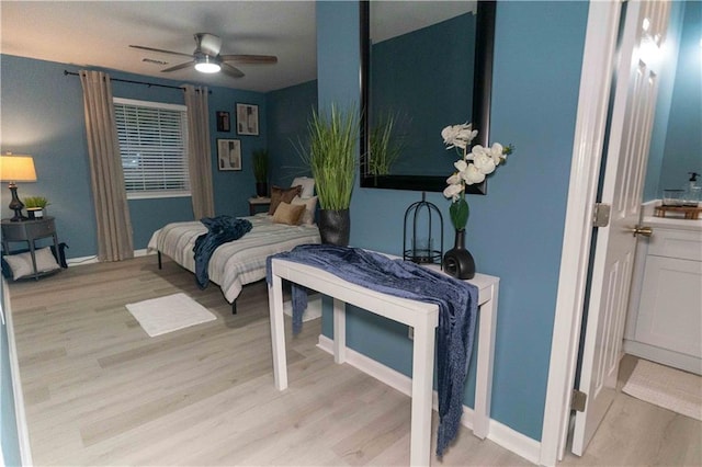 bedroom featuring ceiling fan and light hardwood / wood-style floors