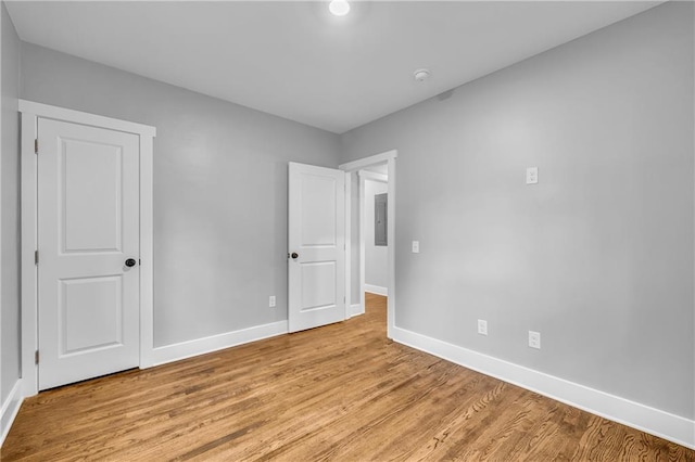 spare room featuring light hardwood / wood-style flooring