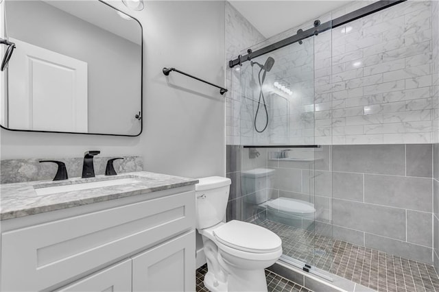 bathroom with toilet, vanity, tile patterned floors, and a shower with shower door