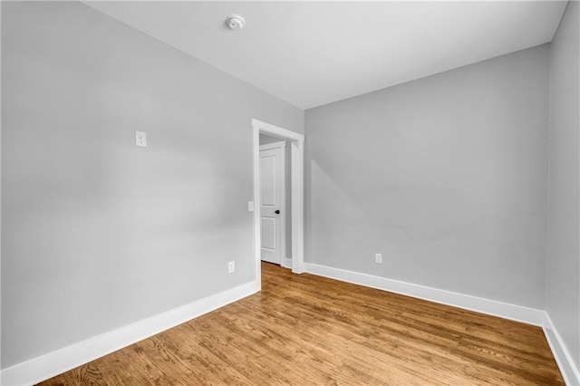 empty room featuring wood-type flooring