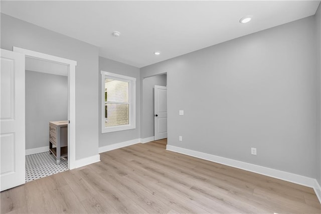 unfurnished bedroom with light wood-type flooring