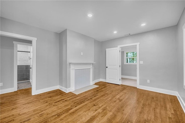 unfurnished living room featuring light hardwood / wood-style floors