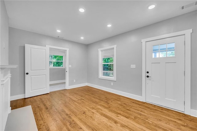 entrance foyer featuring a healthy amount of sunlight and light hardwood / wood-style flooring