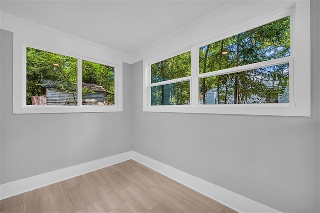 unfurnished room with ornamental molding