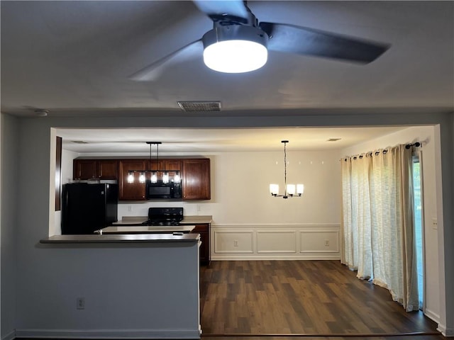 3613 Tinsley Way SW, Atlanta, GA 30331 - kitchen featuring black appliances, dark wood finished floors, hanging light fixtures, a chandelier, and a peninsula