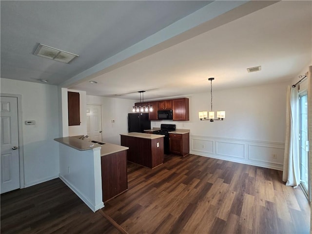 3613 Tinsley Way SW, Atlanta, GA 30331 - kitchen with black appliances, a kitchen island, dark wood-style flooring, a sink, and wainscoting