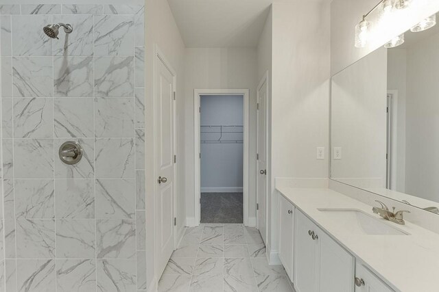 199 Montview Dr, Jefferson, GA 30549 - bathroom featuring a walk in closet, marble finish floor, a tile shower, and vanity