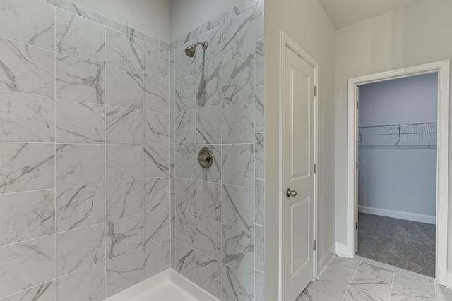 199 Montview Dr, Jefferson, GA 30549 - full bathroom featuring marble finish floor, baseboards, a spacious closet, and a shower stall