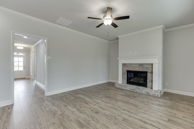 199 Montview Dr, Jefferson, GA 30549 - unfurnished living room with crown molding, baseboards, a glass covered fireplace, and light wood-style floors
