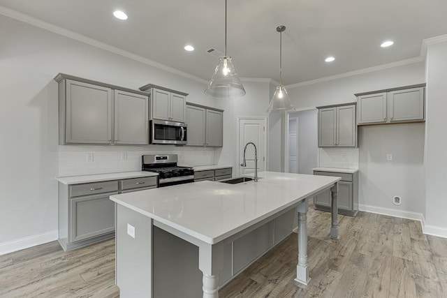 199 Montview Dr, Jefferson, GA 30549 - kitchen featuring gray cabinets, stainless steel appliances, light countertops, pendant lighting, and a sink