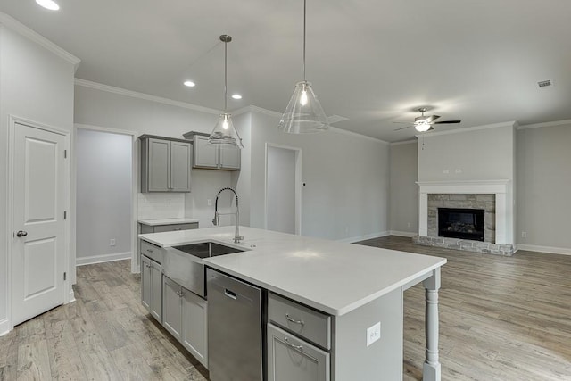 199 Montview Dr, Jefferson, GA 30549 - kitchen featuring a kitchen island with sink, gray cabinets, light countertops, pendant lighting, and stainless steel dishwasher