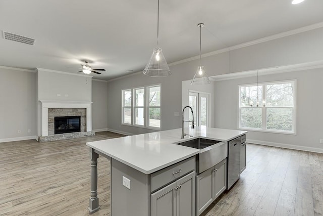 199 Montview Dr, Jefferson, GA 30549 - kitchen with visible vents, dishwasher, open floor plan, a kitchen island with sink, and light countertops