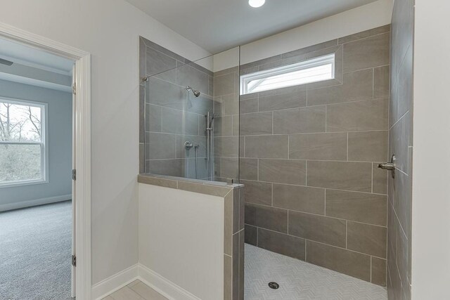 199 Montview Dr, Jefferson, GA 30549 - bathroom featuring a walk in shower, a wealth of natural light, and baseboards