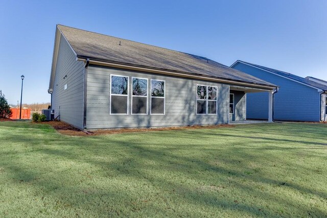 199 Montview Dr, Jefferson, GA 30549 - rear view of property with central AC and a yard