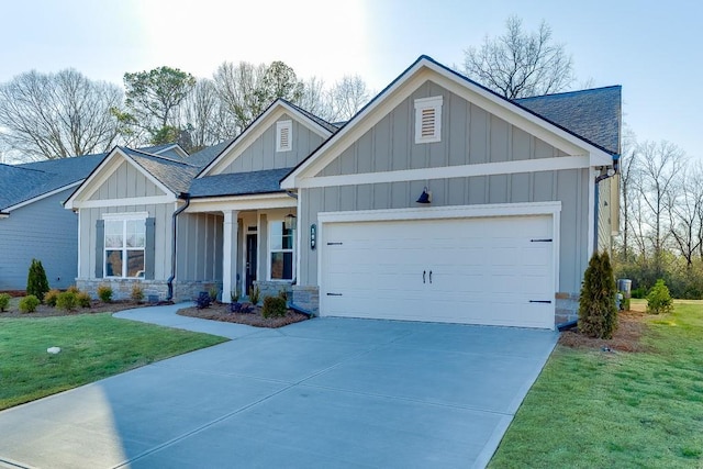199 Montview Dr, Jefferson, GA 30549 - view of front of property featuring a garage, driveway, a shingled roof, and board and batten siding