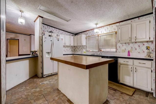 kitchen with a kitchen island, a textured ceiling, dishwasher, decorative light fixtures, and white fridge with ice dispenser