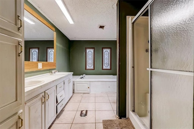 bathroom featuring tile floors, separate shower and tub, dual vanity, and a textured ceiling