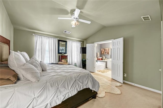 carpeted bedroom featuring baseboards, visible vents, vaulted ceiling, and a ceiling fan