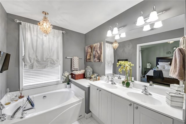 ensuite bathroom with a garden tub, double vanity, ensuite bath, and a sink