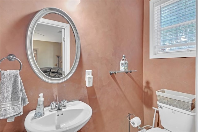 bathroom with a sink and toilet