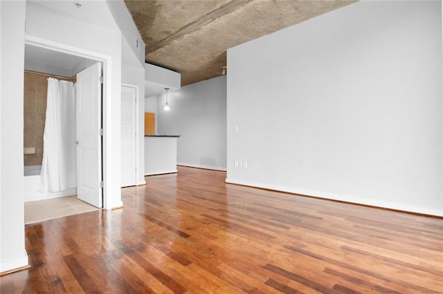 860 Peachtree St NE Unit 909, Atlanta, GA 30308 - spare room featuring wood finished floors
