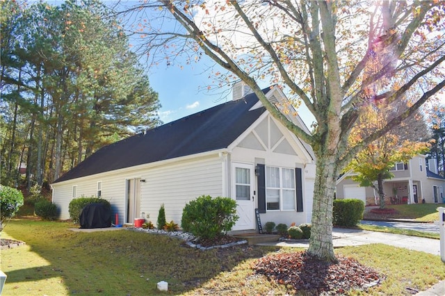 view of home's exterior with a lawn