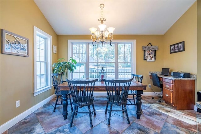 dining room featuring a chandelier, lofted ceiling, and baseboards