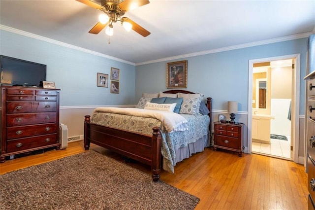 bedroom with light wood-type flooring, crown molding, and ceiling fan