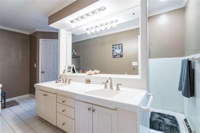 bathroom featuring double vanity, ornamental molding, a sink, and tile patterned floors