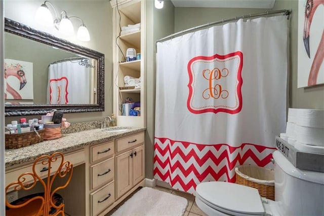 bathroom with vanity, tile patterned flooring, toilet, and a shower with curtain