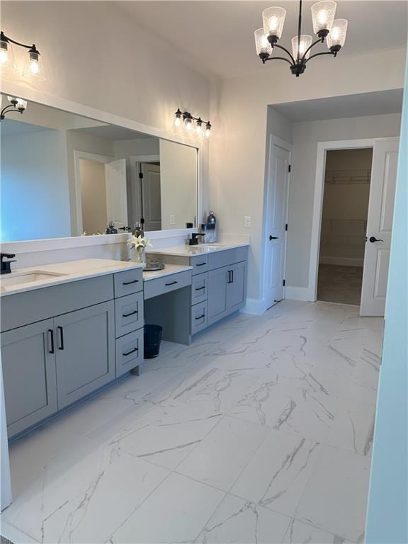 4020 Sierra Knolls Ct, Cumming, GA 30040 - bathroom with a notable chandelier, a walk in closet, vanity, marble finish floor, and baseboards
