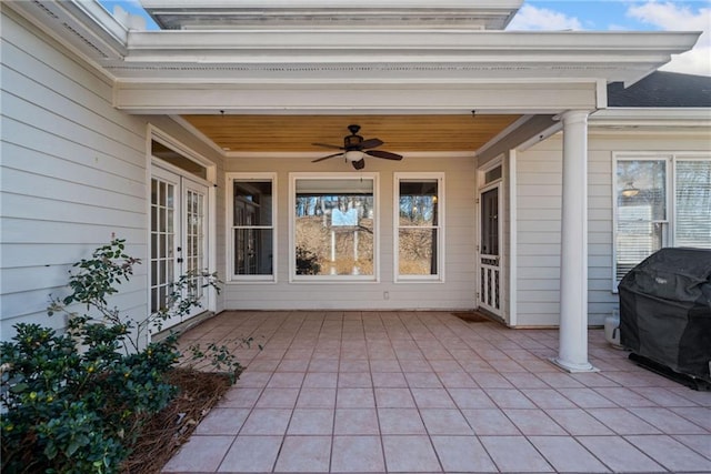 view of patio featuring ceiling fan and a grill