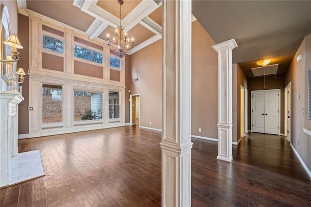 unfurnished living room featuring beam ceiling, crown molding, coffered ceiling, and decorative columns