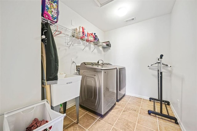 washroom with washing machine and clothes dryer