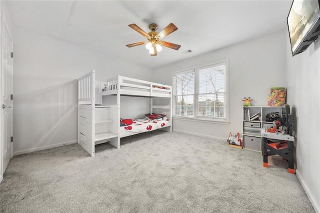 carpeted bedroom featuring ceiling fan