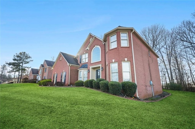 view of home's exterior with a yard