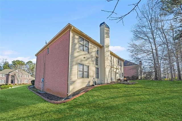 view of side of property featuring a yard