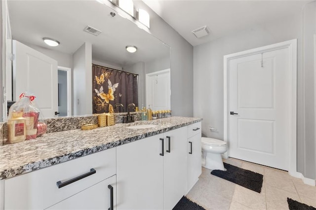 full bathroom featuring tile patterned floors, visible vents, toilet, and vanity