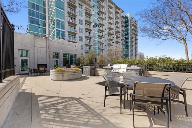 view of patio / terrace featuring an outdoor kitchen, a grill, and outdoor dining area