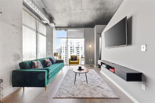 living room featuring a wall of windows